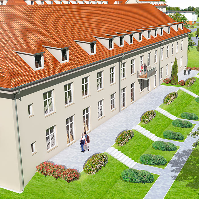 Historisches Gebäude mit rotem Dach und gepflegtem Garten.